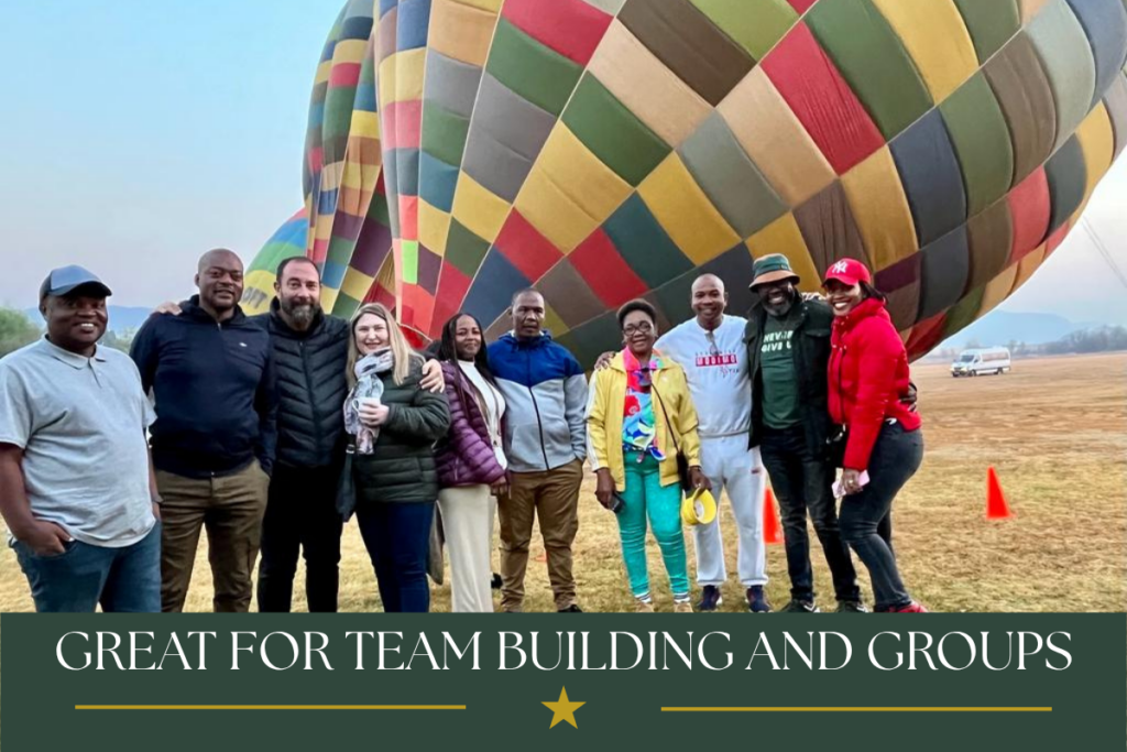 Corporate team building group enjoying a sunrise hot air balloon experience in the Magalies River Valley
