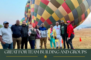 Corporate team building group enjoying a sunrise hot air balloon experience in the Magalies River Valley