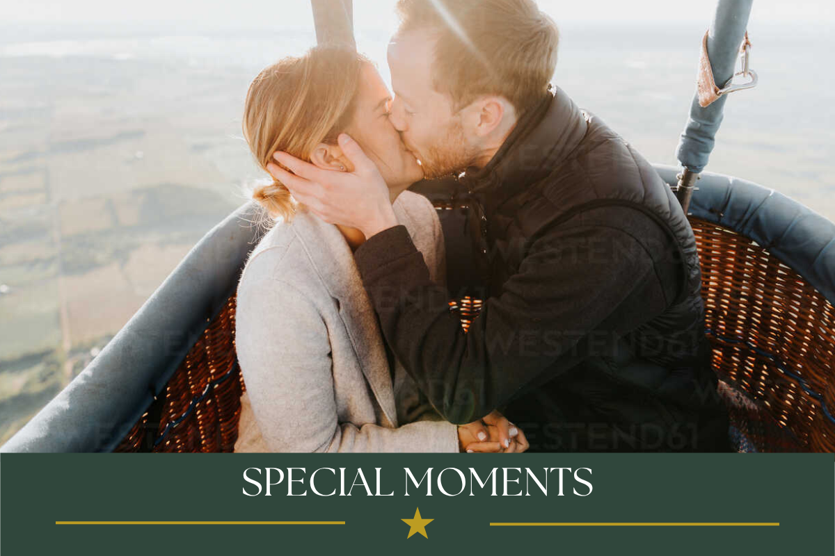 Couple sharing a romantic moment during a sunrise hot air balloon flight.