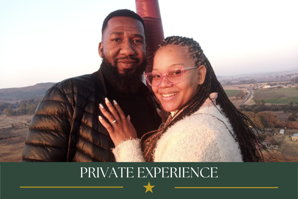 Couple enjoying a private sunrise balloon safari experience over the Magalies River Valley.
