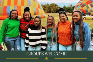 Friends enjoying a group hot air balloon experience at Bill Harrop’s “Original” Balloon Safaris.
