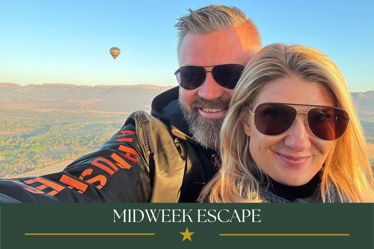 Couple enjoying a sunrise hot air balloon flight over the Magalies River Valley during the Bill Harrop’s Birthday Bash celebration.