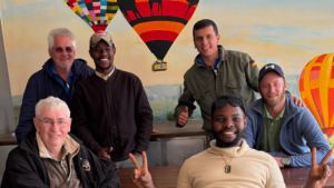 Student hot air balloon pilots and instructors participating in balloon training at Bill Harrop's Original Balloon Safaris.