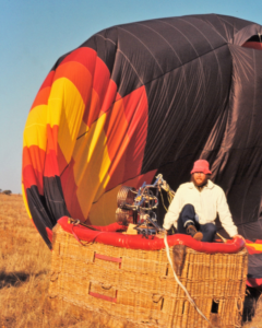 Young Bill Harrop preparing one of the first hot air balloons in South Africa during the early days of Bill Harrop's Original Balloon Safaris in 1981.