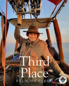 Third-place winner Felicity Clegg standing inside a hot air balloon basket during flight