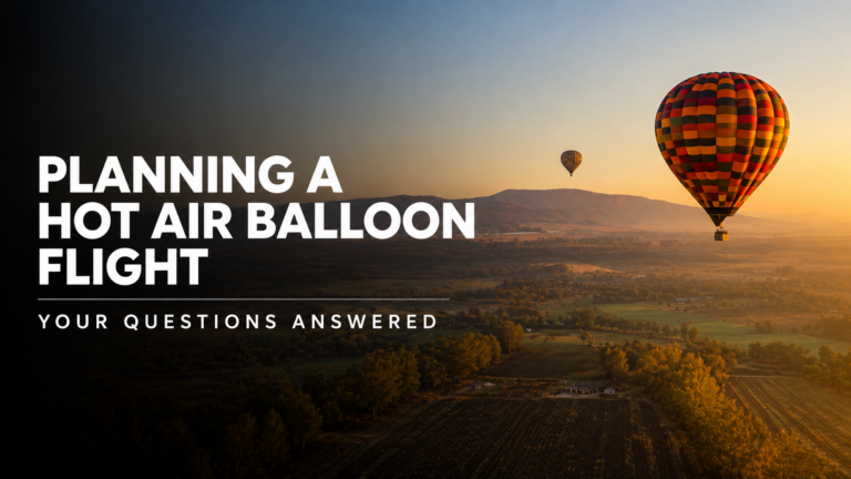 Two hot air balloons flying over the Magalies River Valley at sunrise