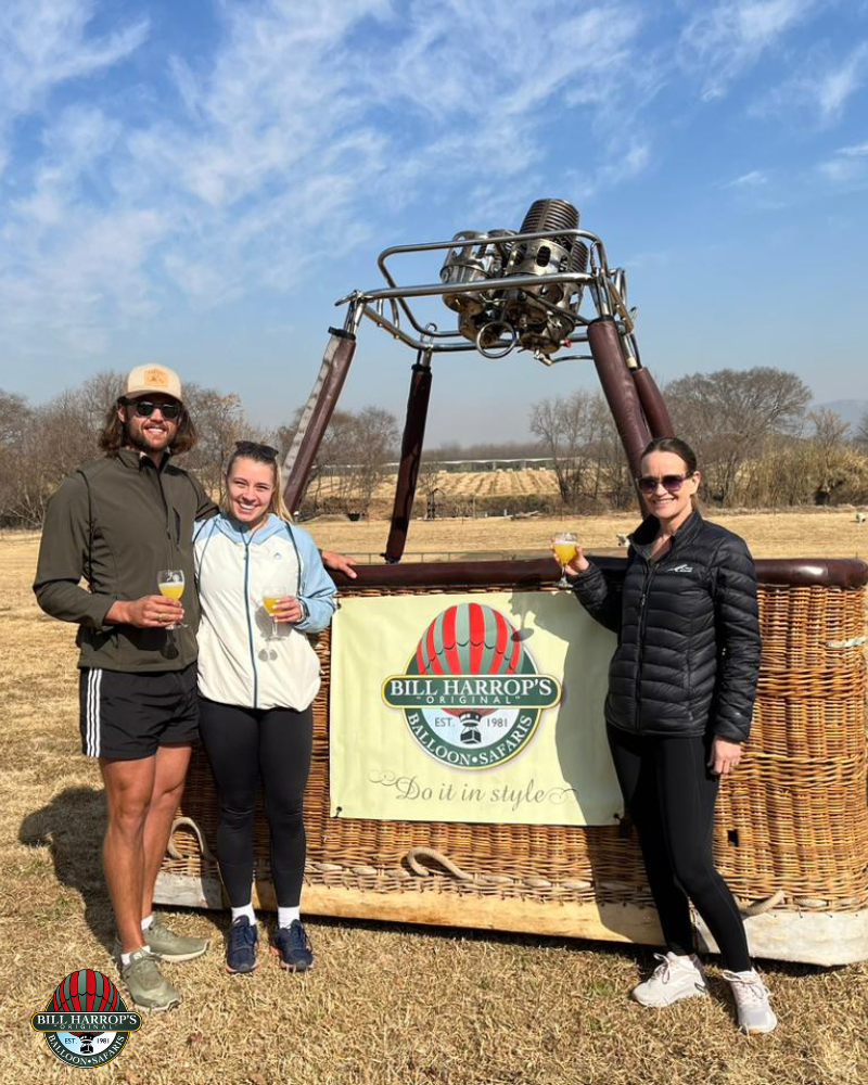 Group of guests celebrating inside a Bill Harrop’s hot air balloon basket